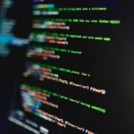 Colorful lines of code on a computer screen showcasing programming and technology focus.