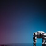 A close-up of a futuristic robot toy on a reflective surface against a gradient background.
