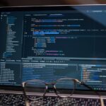 Laptop screen showing debugging software with code, perfect for tech and software development themes.